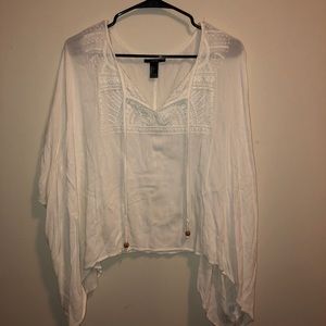 Cream flowy blouse.